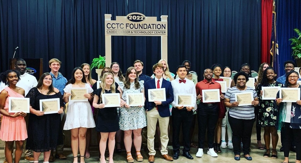 30 students smile during scholarship banquet