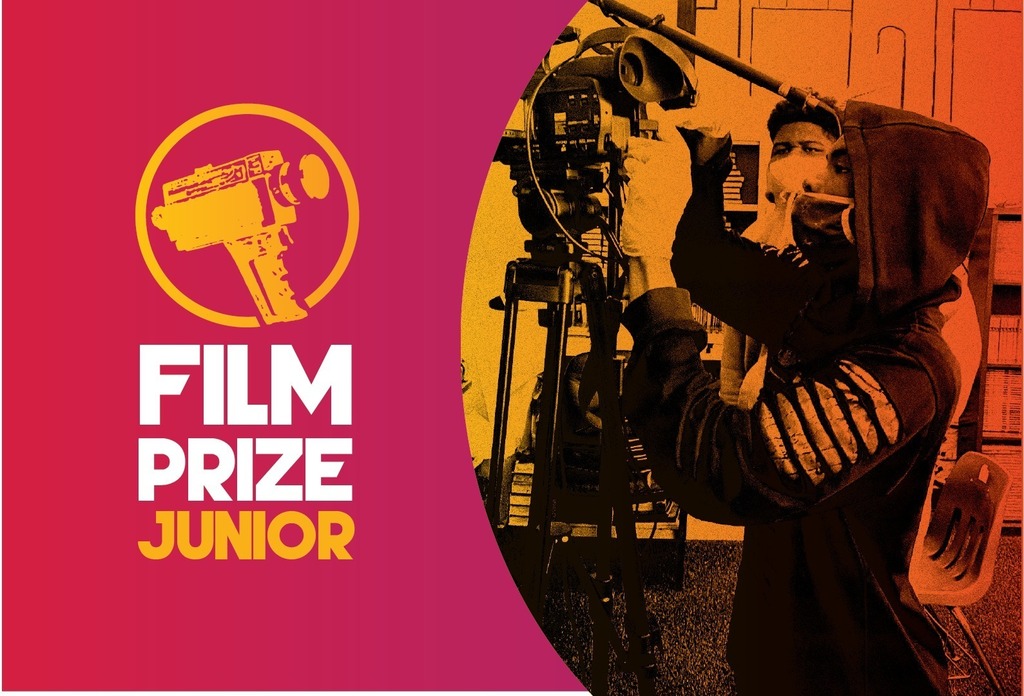 student holds a film camera for Film Prize Junior